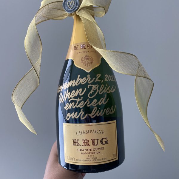 Gold lettering on Champagne Bottle